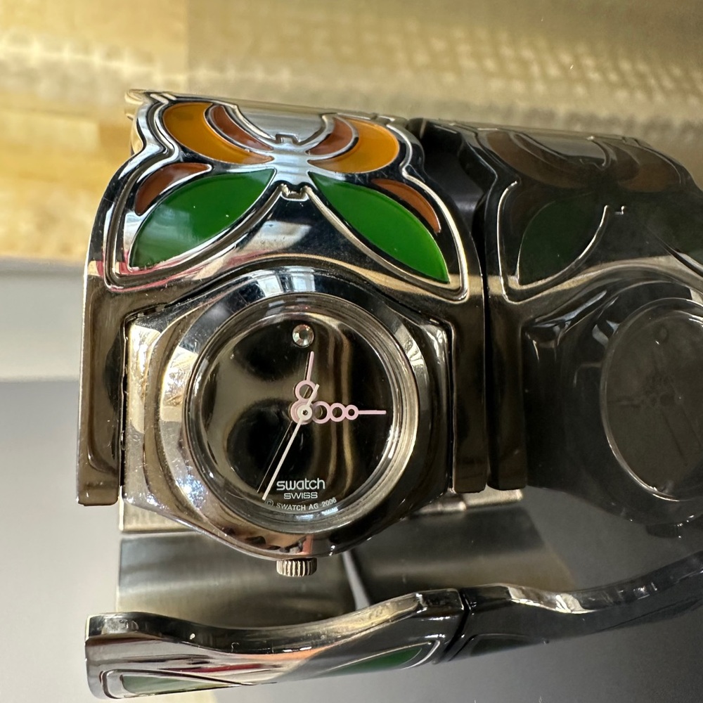Unique Swatch Silver Watch with Green and Orange Details